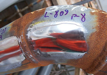Fig. 1 — Section of a line that will operate at low temperature, after metallographic preparation for the replica.