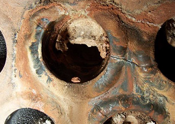 Fig. 3 — Crack in a heat exchanger tube sheet.